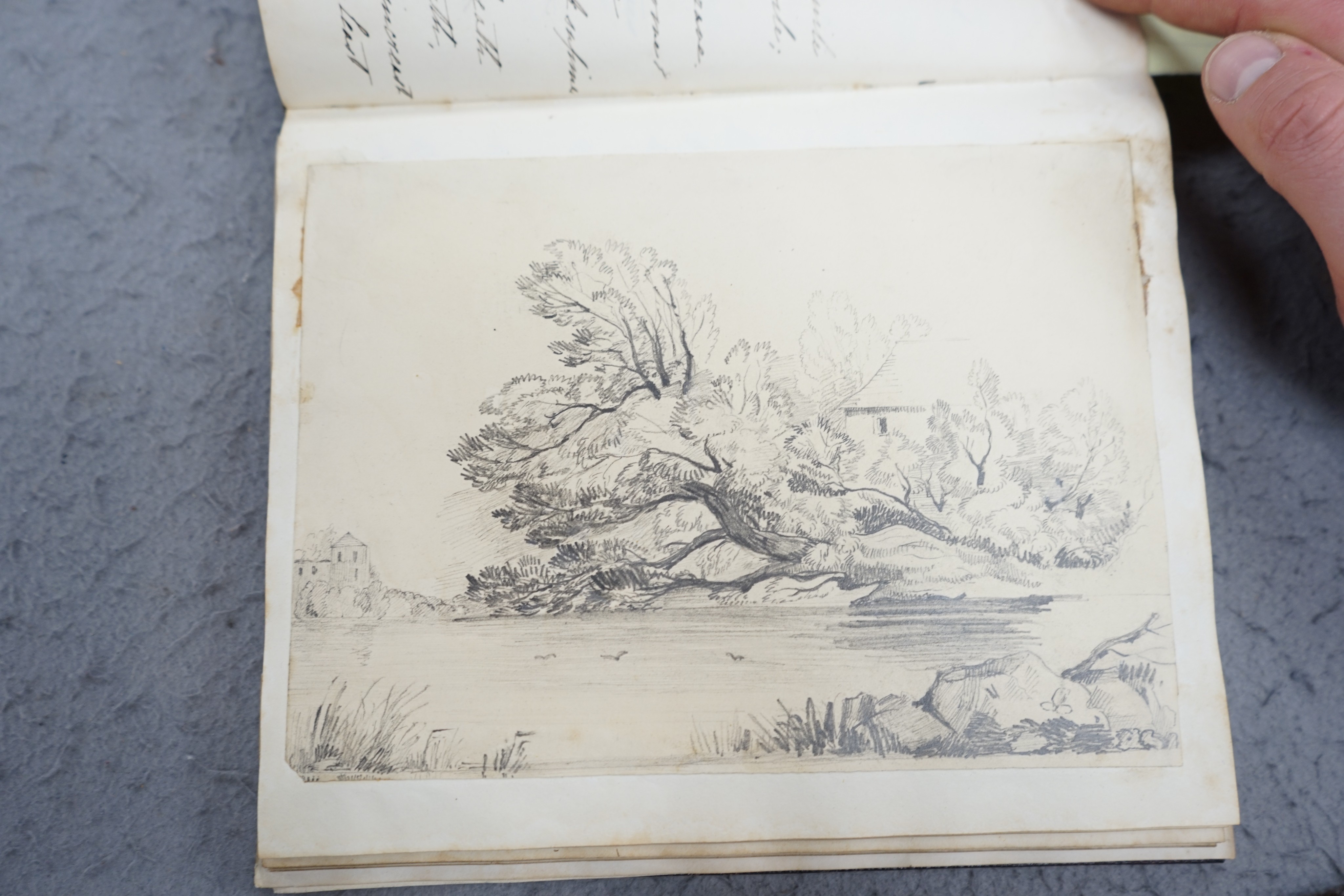 An early 19th century hand written journal, sketch book with scraps, coloured engravings, etc.